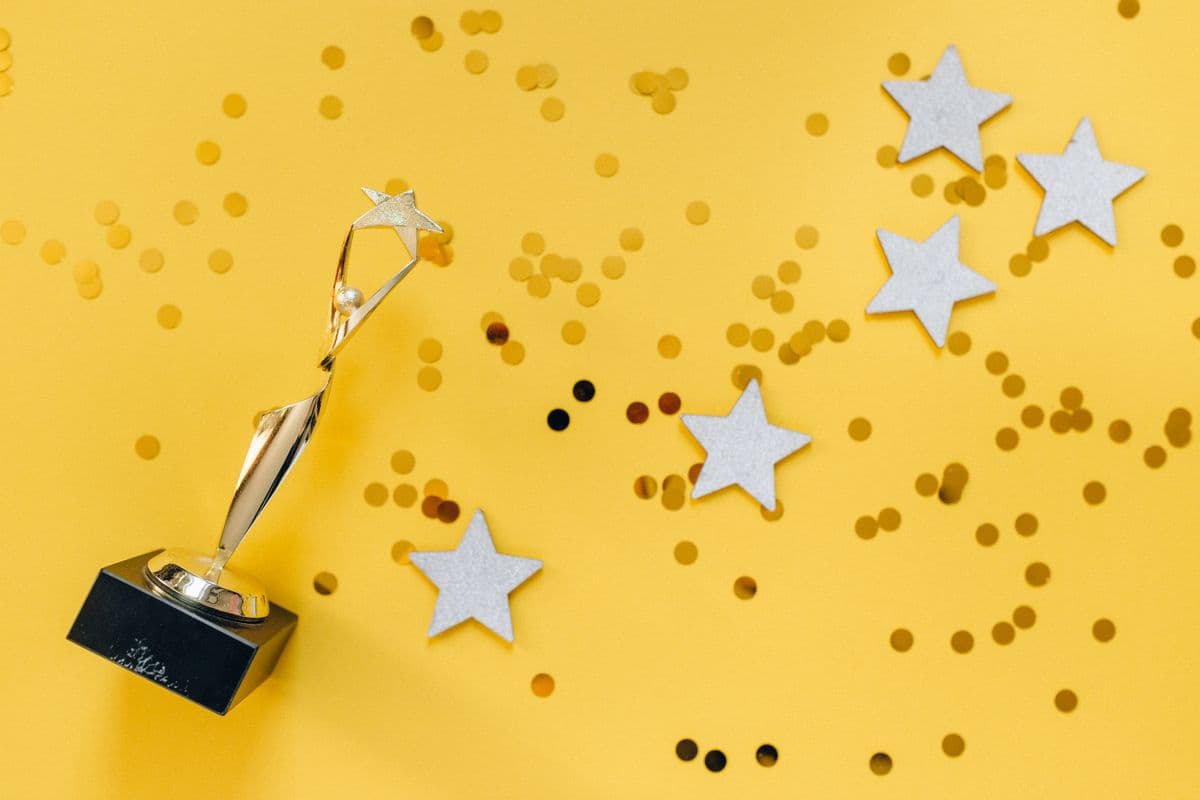 A trophy and stars representing a reward earned